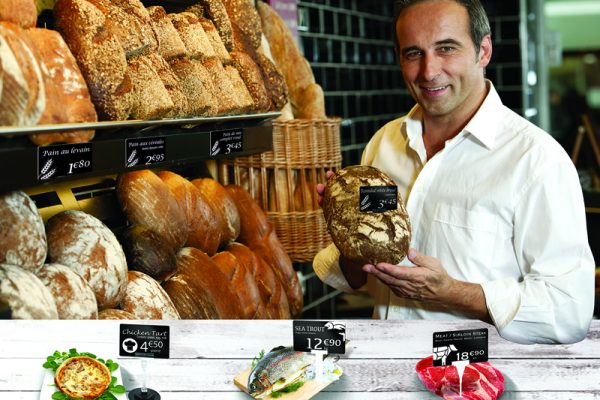 Baker holding bread